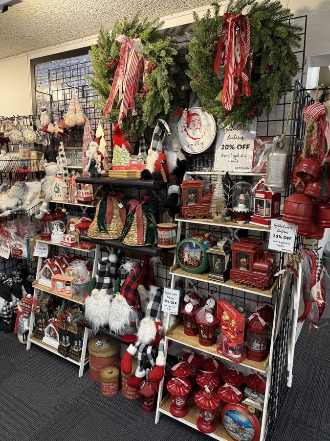 A full Christmas display of red ornaments, wreaths, gnomes, and holiday decor